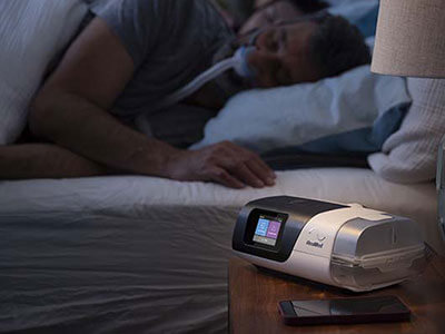 patient sleeping with airsense 11 elite cpap sleep apnoea device 400x300-1